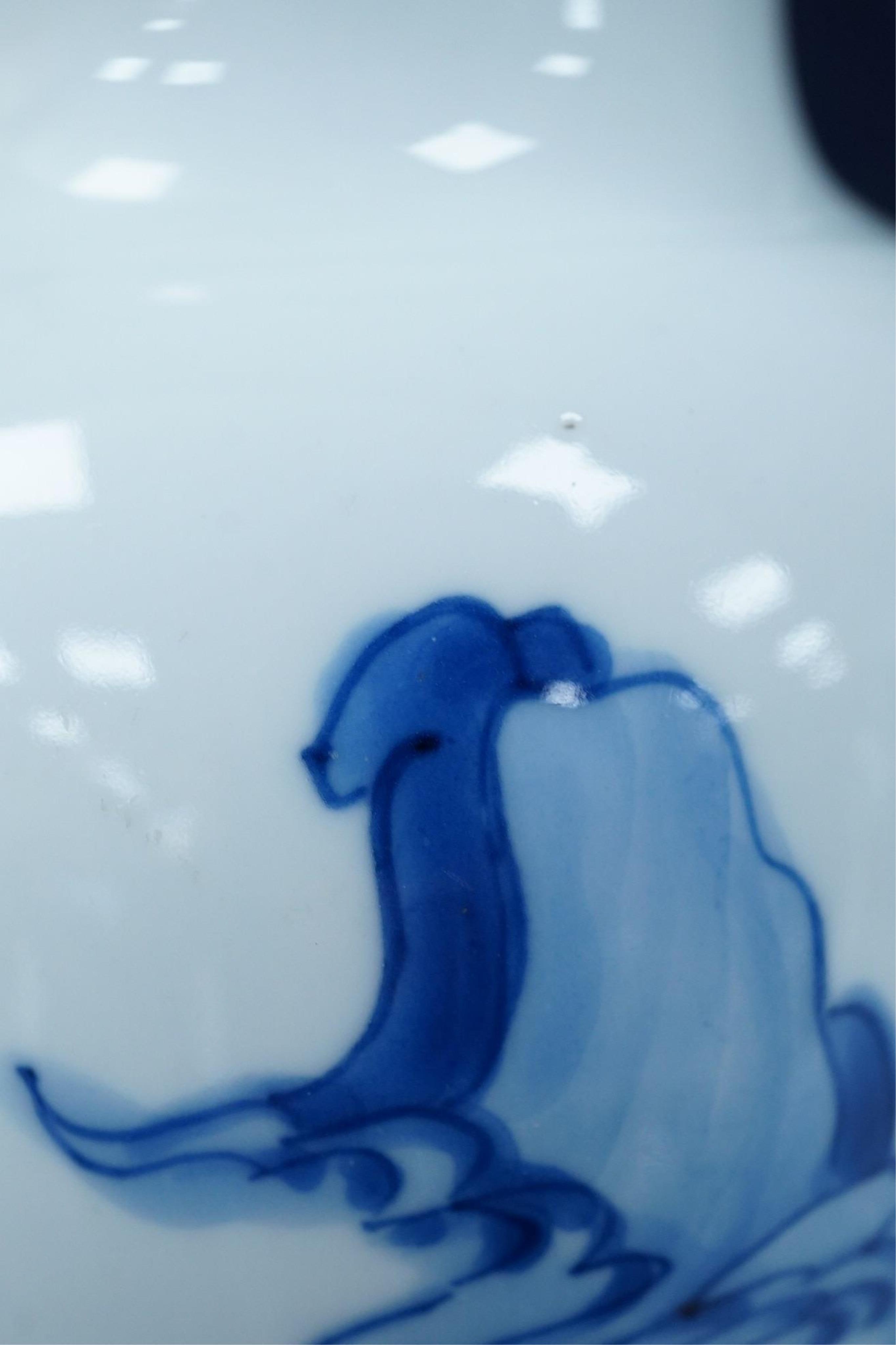 A Chinese blue and white baluster vase, early Kangxi, and associated cover